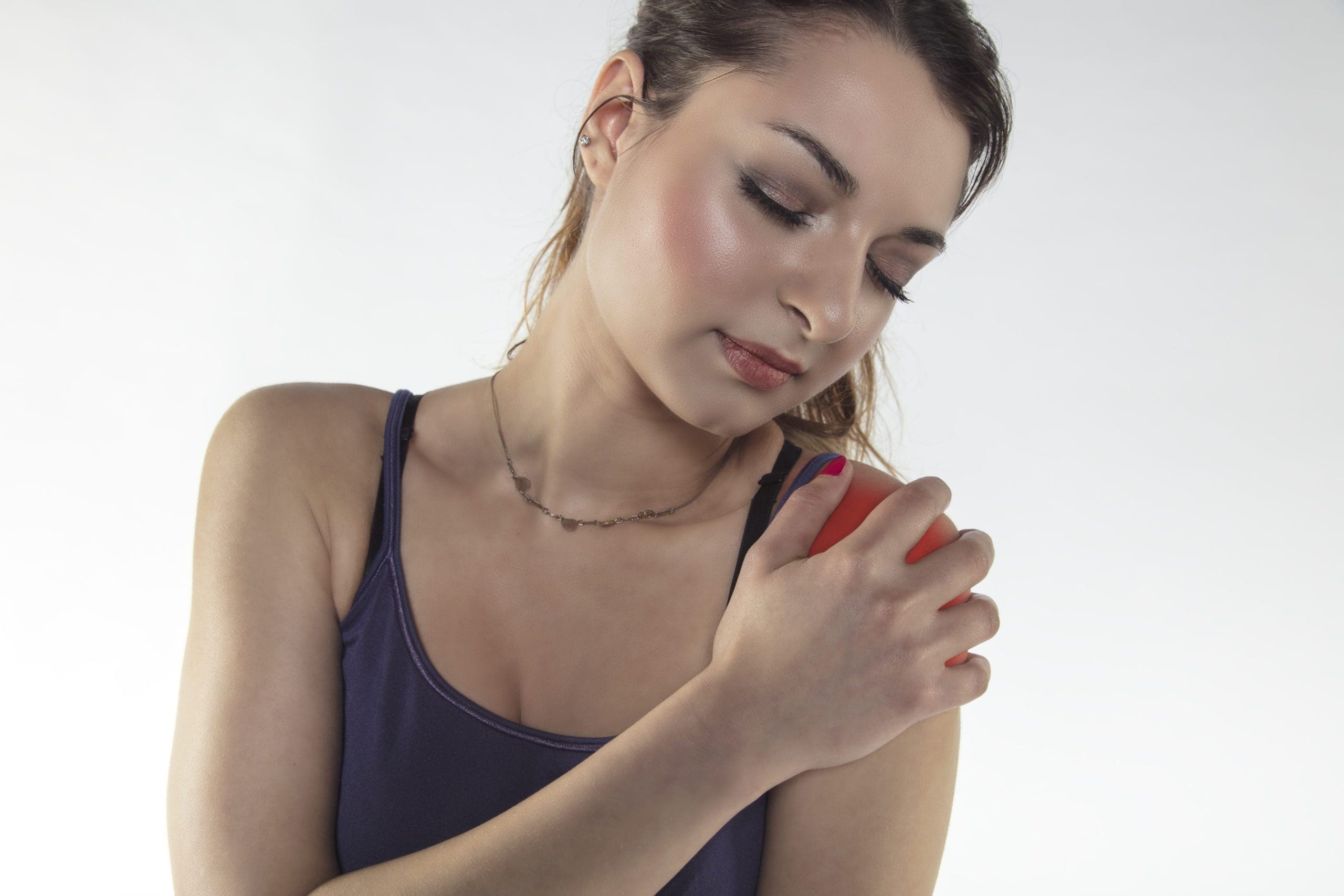 A young woman is struggling with pain, isolated on background Medical Law